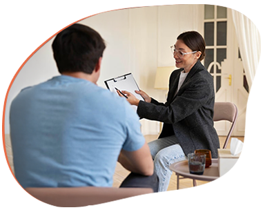 Therapist speaking with a patient during a private mental health counseling session.