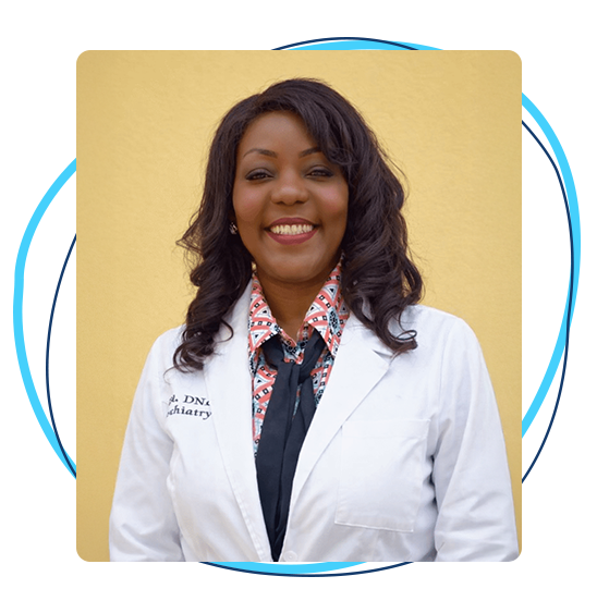 Psychiatric nurse practitioner smiling in a white medical coat