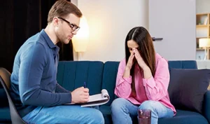 Therapist discussing bipolar spectrum symptoms with a patient during an assessment