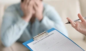 Mental health professional reviewing a psychosis symptom and safety questionnaire