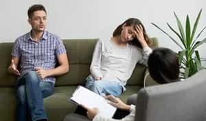 Therapist supporting a patient during a PTSD and trauma symptom evaluation