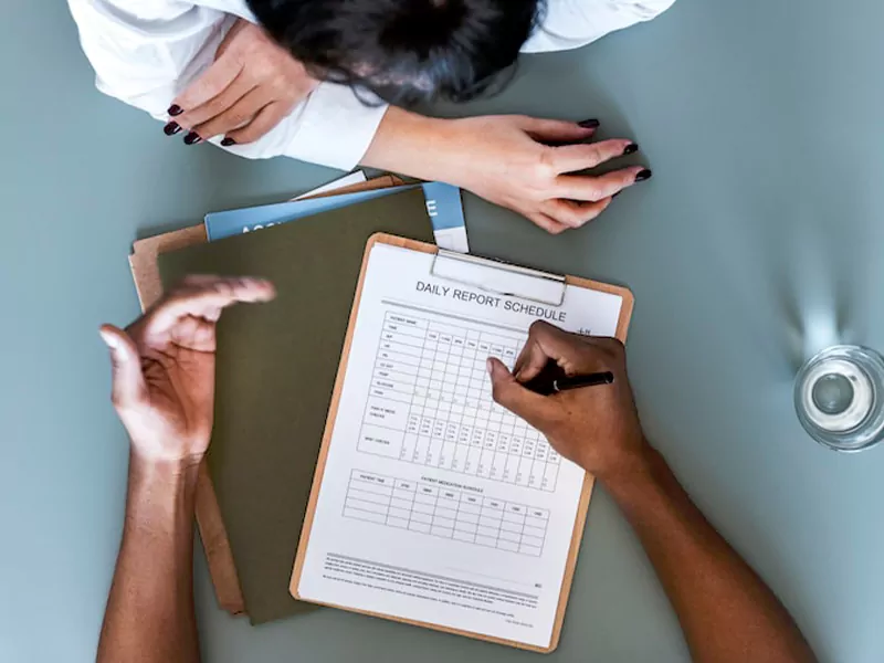 Doctor reviewing ADHD evaluation and management with an adult patient